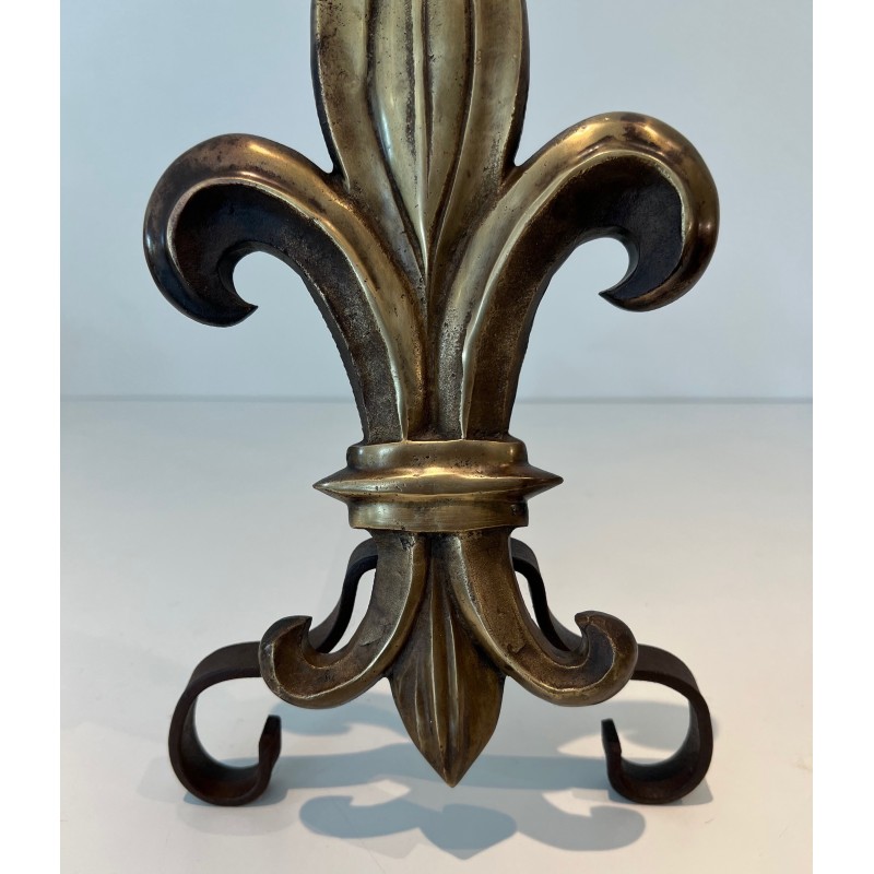 Pair of vintage bronze and wrought iron andirons representing a fleur-de-lys, France 1940