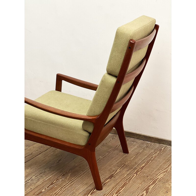 Vintage armchair with ottoman in solid teak wood by Ole Wanscher for Poul Jeppensens, Denmark 1960