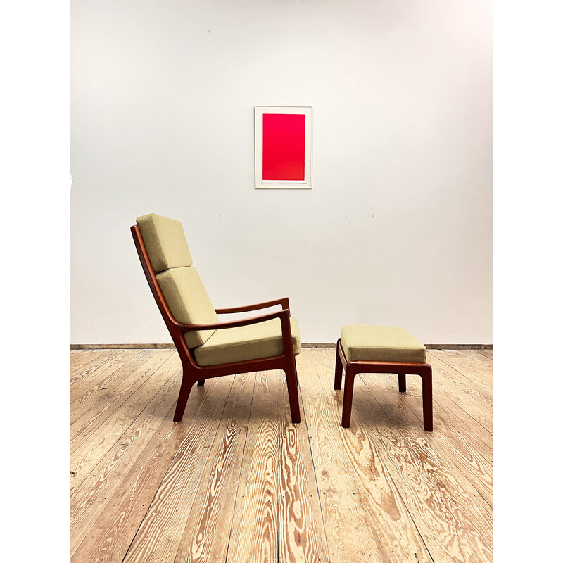 Vintage armchair with ottoman in solid teak wood by Ole Wanscher for Poul Jeppensens, Denmark 1960