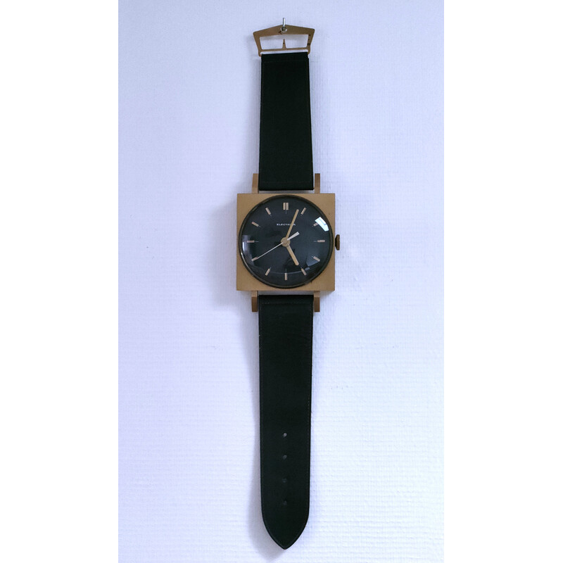 Vintage wall clock in the shape of a black imitation leather wristwatch, 1970