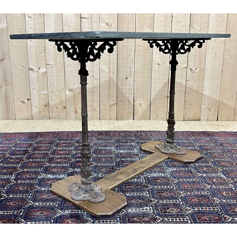 Vintage bistro table in oak and cast iron