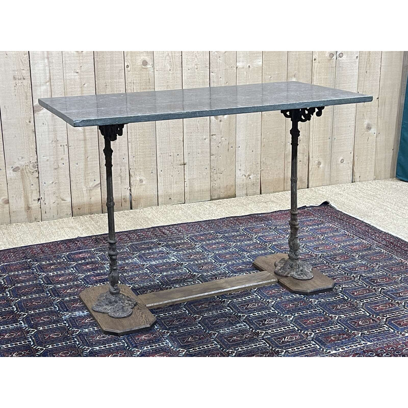 Vintage bistro table in oak and cast iron