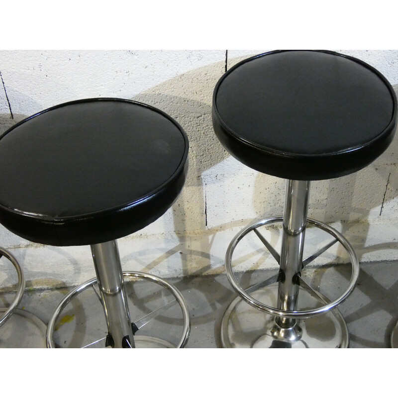 Set of 4 vintage stools in polished stainless steel and black skai, 1970