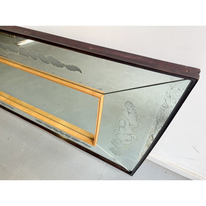 Vintage wall mirror with a concave top edge