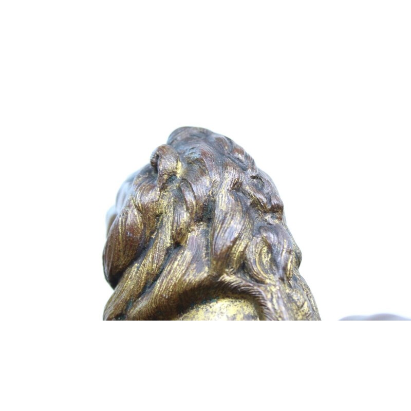 Vintage lying lion in gold cast iron