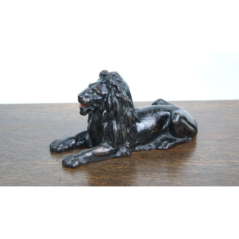 Vintage cast iron lying lion