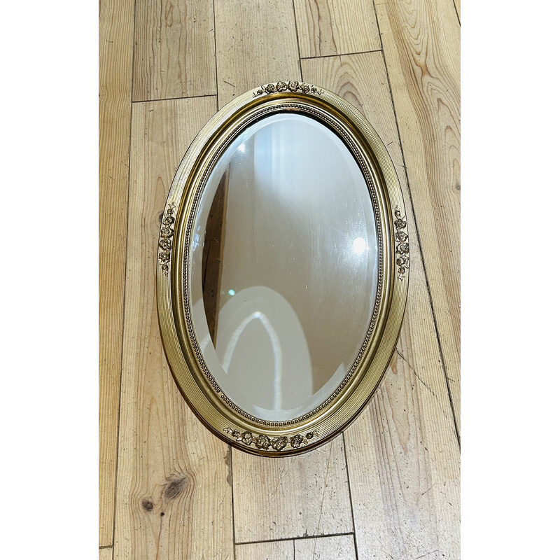 Espejo oval vintage con marco de madera dorada