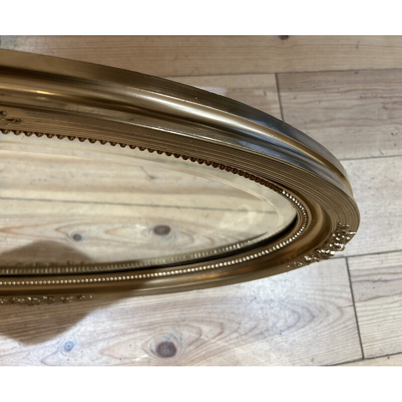 Espejo oval vintage con marco de madera dorada