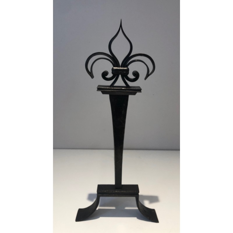 Pair of vintage wrought iron andirons topped with fleur-de-lys, France 1950