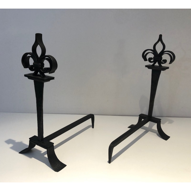 Pair of vintage wrought iron andirons topped with fleur-de-lys, France 1950