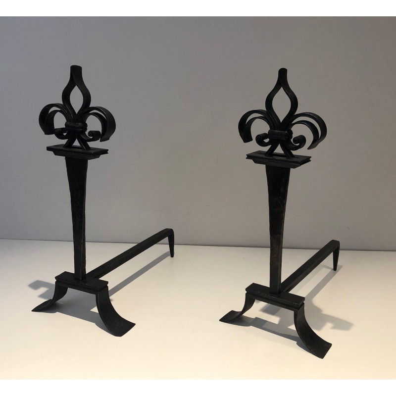 Pair of vintage wrought iron andirons topped with fleur-de-lys, France 1950