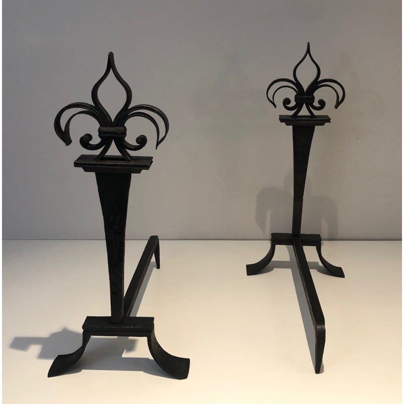 Pair of vintage wrought iron andirons topped with fleur-de-lys, France 1950