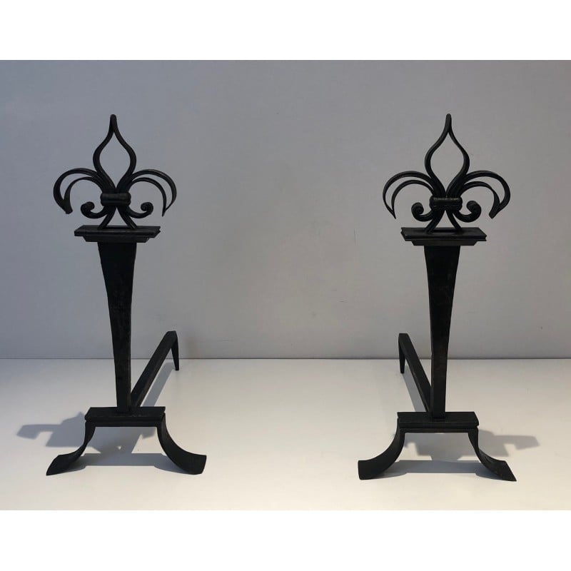 Pair of vintage wrought iron andirons topped with fleur-de-lys, France 1950