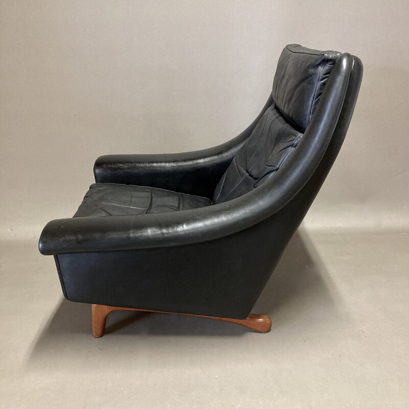 Vintage armchair in black leather and teak by Aage Christiansen, 1950