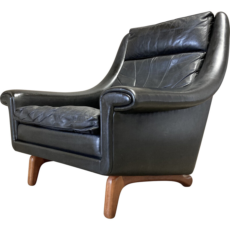 Vintage armchair in black leather and teak by Aage Christiansen, 1950