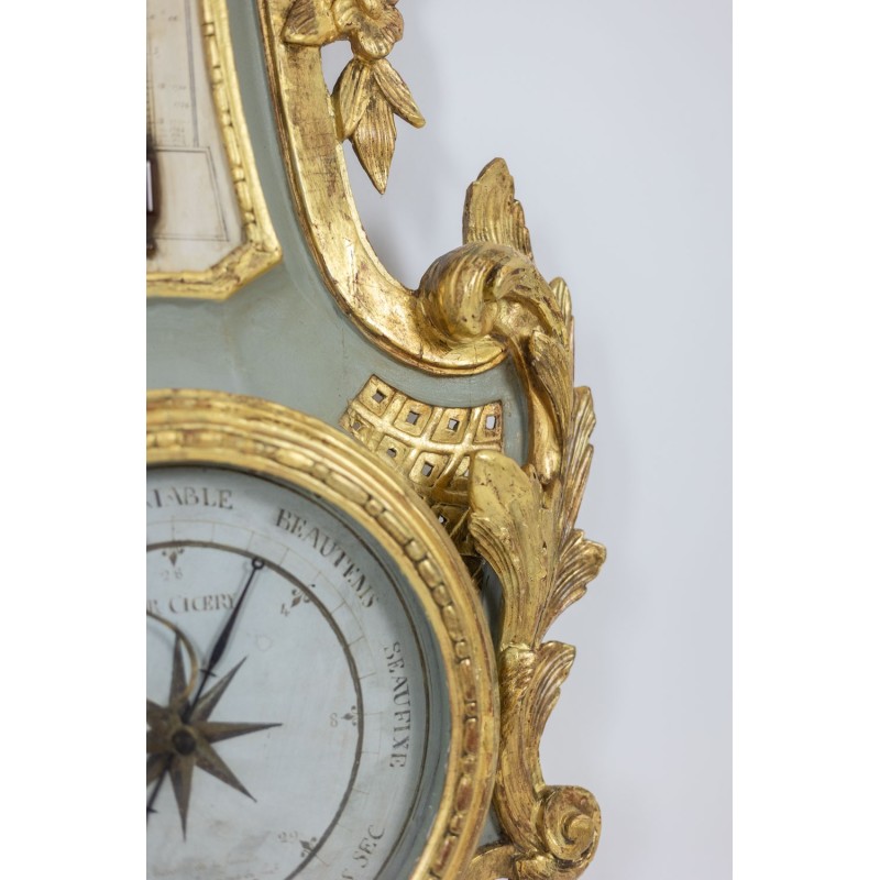 Vintage barometer-thermometer in carved and gilded wood, France