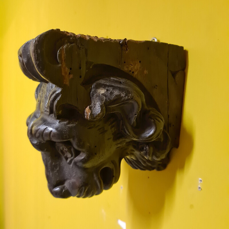 Scultura vintage in legno nero lucido raffigurante una testa di leone