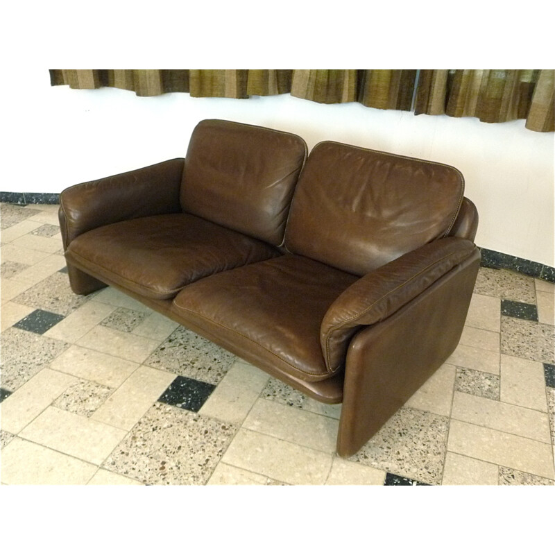 DS61 two-seater brown leather sofa produced by De Sede - 1960s