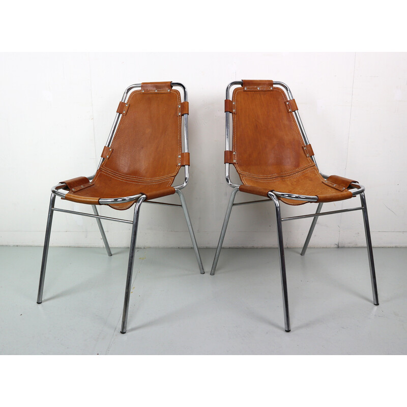 Pair of vintage bar stools in chromed tubular metal and leather by Charlotte Perriand for Les Arcs, 1960