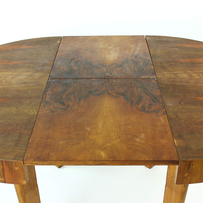 Round dining table in walnut by Jitona - 1960s