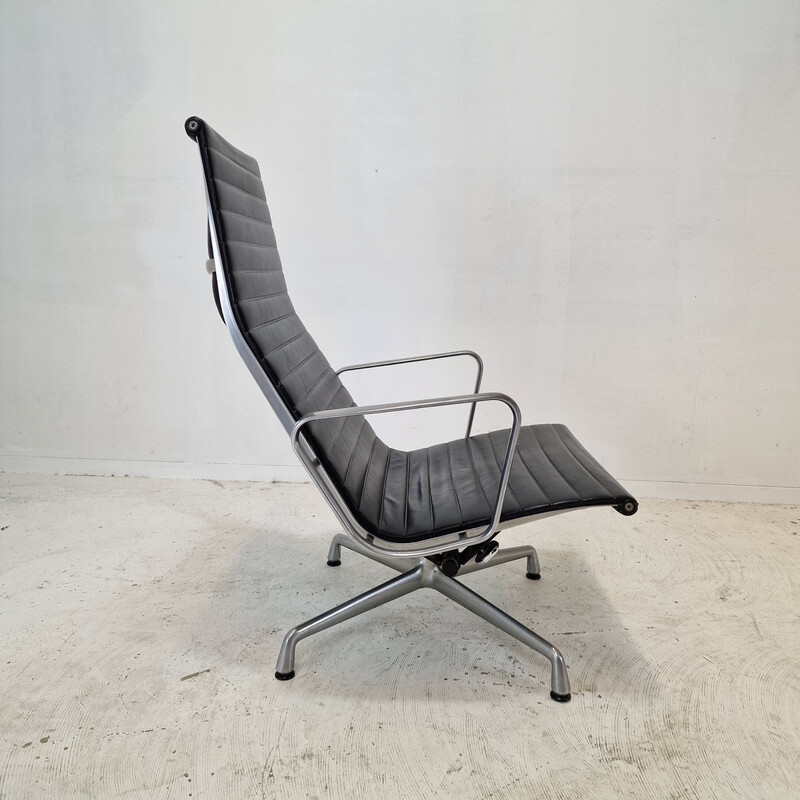 Vintage fauteuil met voetenbankje van Charles en Ray Eames in aluminium voor Vitra, 1999