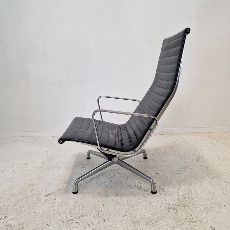Vintage fauteuil met voetenbankje van Charles en Ray Eames in aluminium voor Vitra, 1999