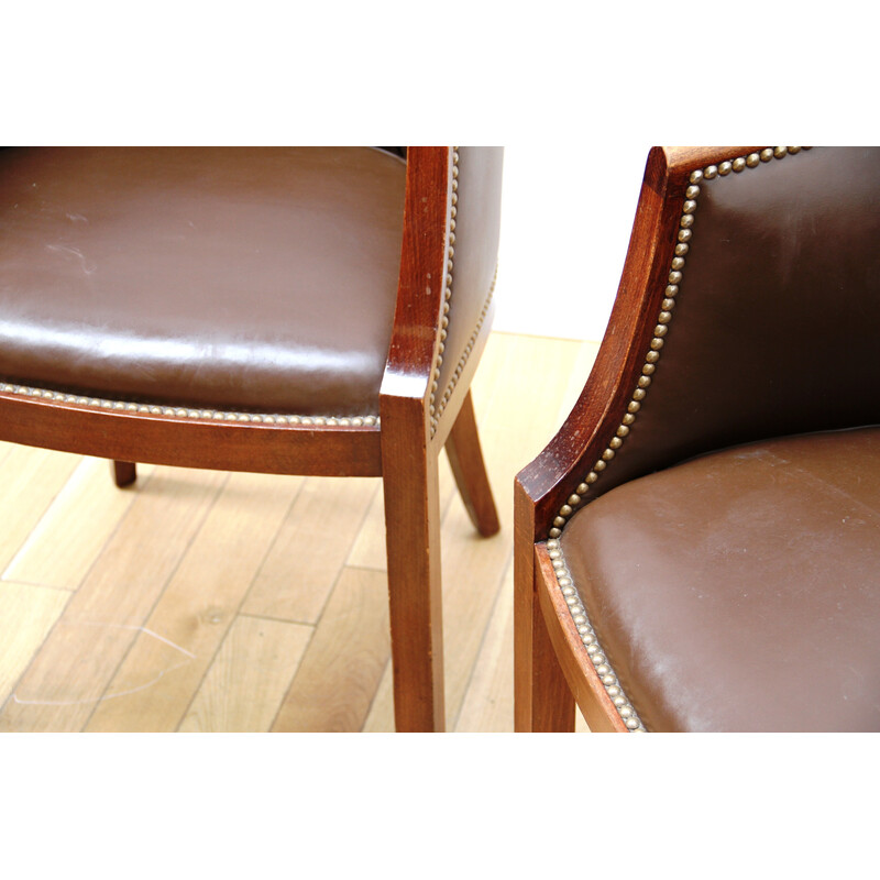 Pair of vintage barrel armchairs in varnished wood and brown leather