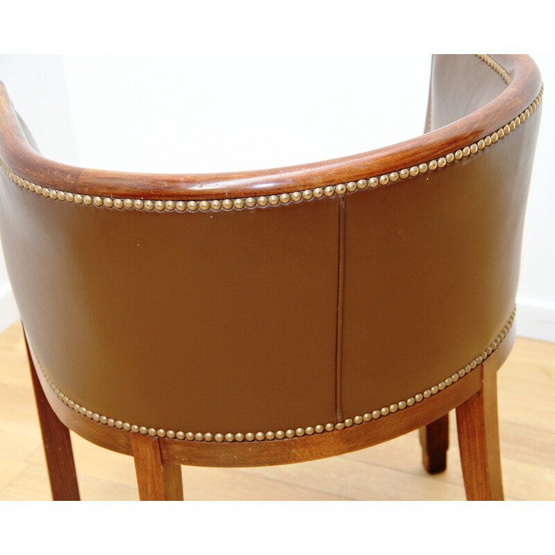 Paire de fauteuils vintage tonneau en bois vernis et cuir marron