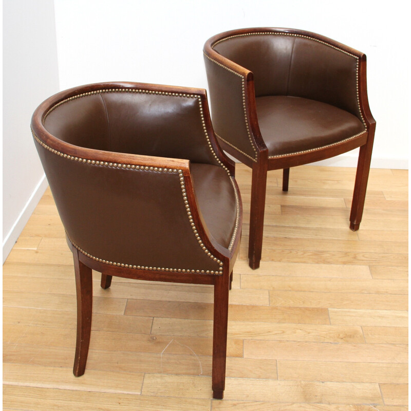 Pair of vintage barrel armchairs in varnished wood and brown leather