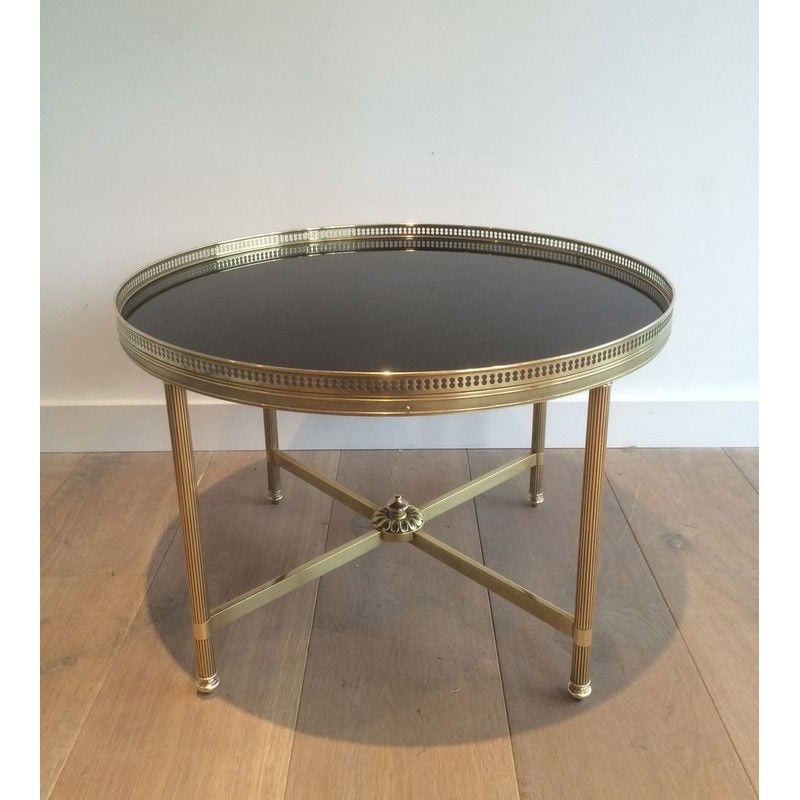 Vintage round coffee table in brass and black lacquered glass for La Maison Jansen, France 1940