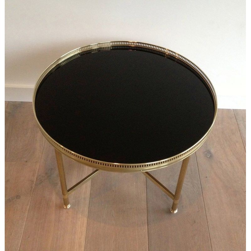 Vintage round coffee table in brass and black lacquered glass for La Maison Jansen, France 1940