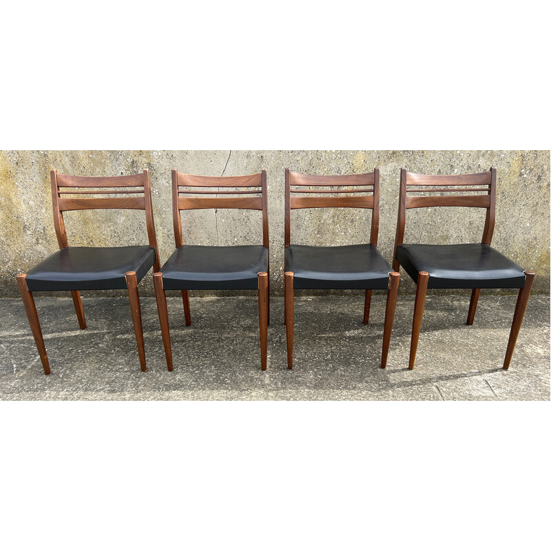 Set van 4 vintage teakhouten en zwarte skai stoelen
