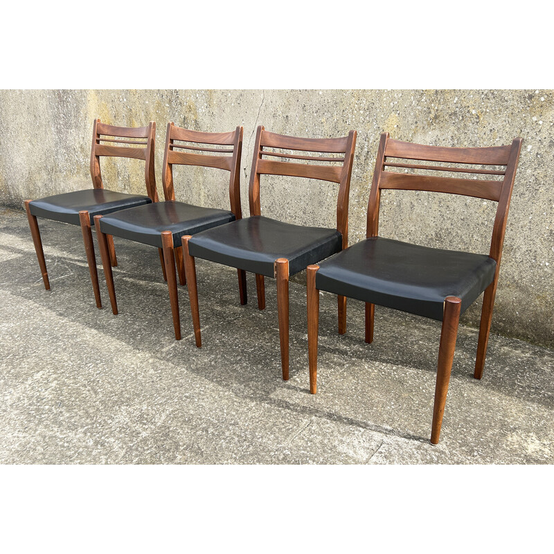 Set van 4 vintage teakhouten en zwarte skai stoelen
