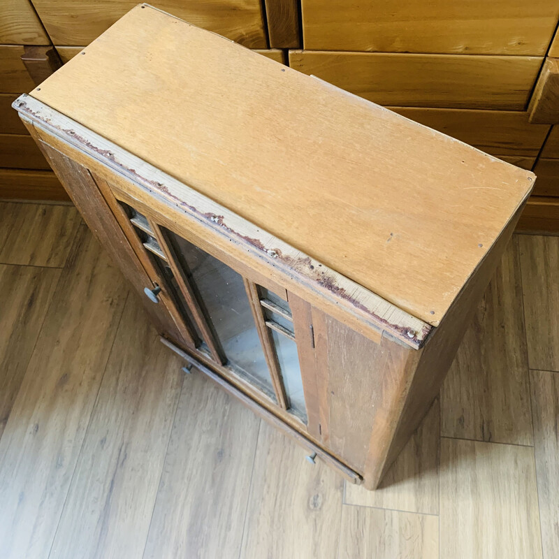 Vintage medicine cabinet in wood and glass