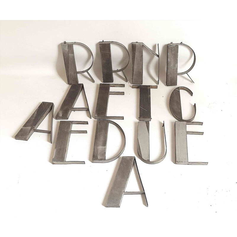 Vintage metal lettering composed of 14 letters, 1930