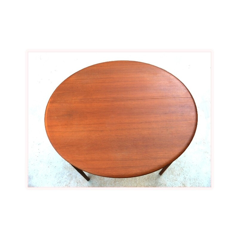 Scandinavian teak dining table with integrated extensions - 1960s