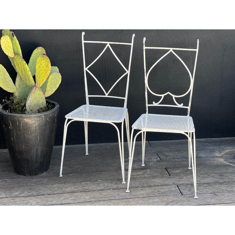 Pair of vintage perforated metal chairs and armchairs by Mathieu Matégot, 1950