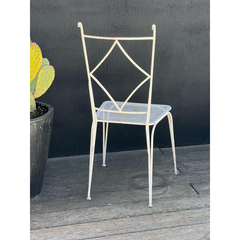 Pair of vintage perforated metal chairs and armchairs by Mathieu Matégot, 1950