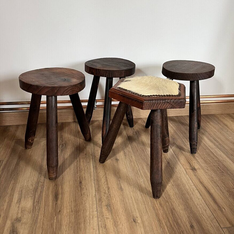 Set of 4 vintage tripod stools covered in cowhide