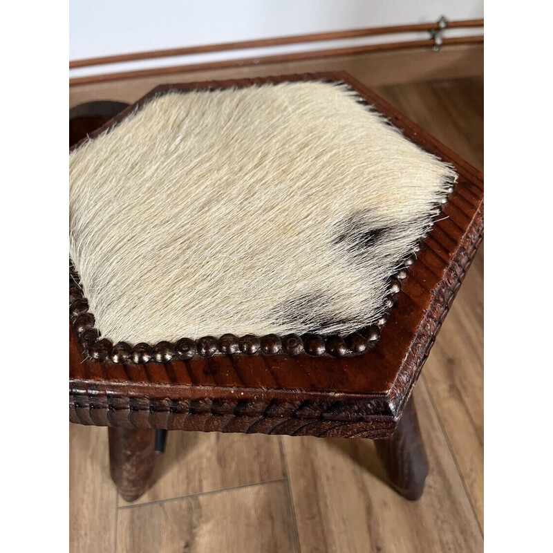 Set of 4 vintage tripod stools covered in cowhide