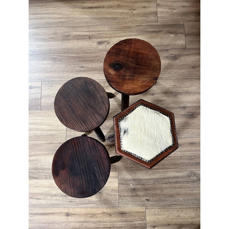 Set of 4 vintage tripod stools covered in cowhide
