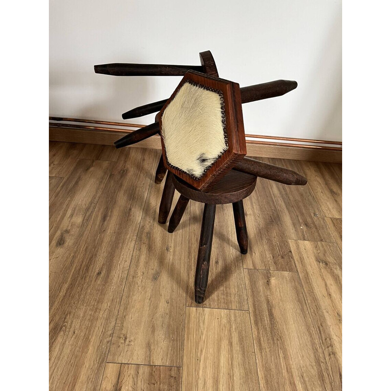 Set of 4 vintage tripod stools covered in cowhide