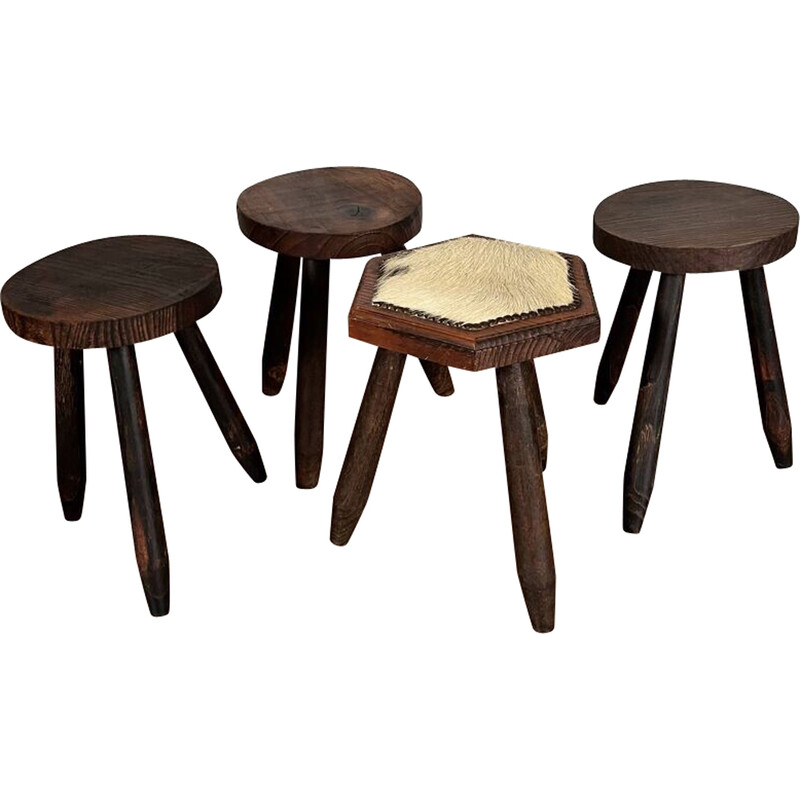 Set of 4 vintage tripod stools covered in cowhide