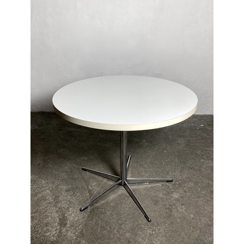 Vintage round dining table with central base in chrome steel, 1960