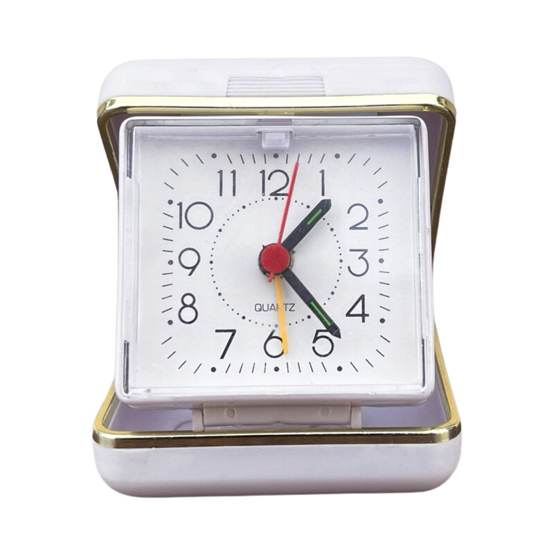 Vinage white travel alarm clock in plastic and brass, Germany 1990