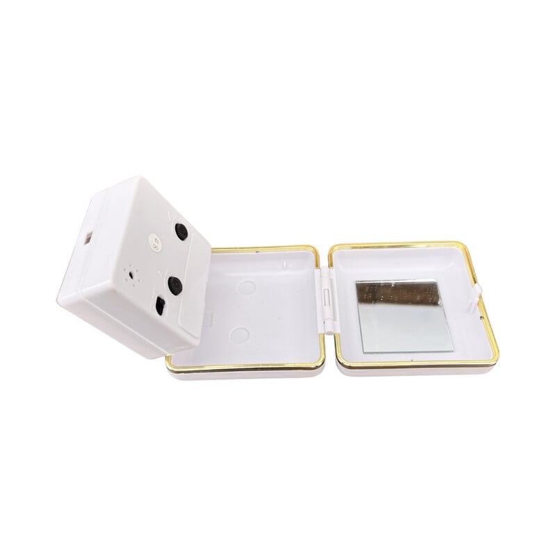 Vinage white travel alarm clock in plastic and brass, Germany 1990