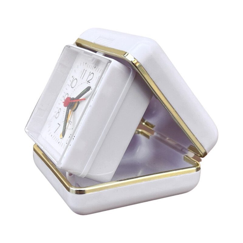 Vinage white travel alarm clock in plastic and brass, Germany 1990