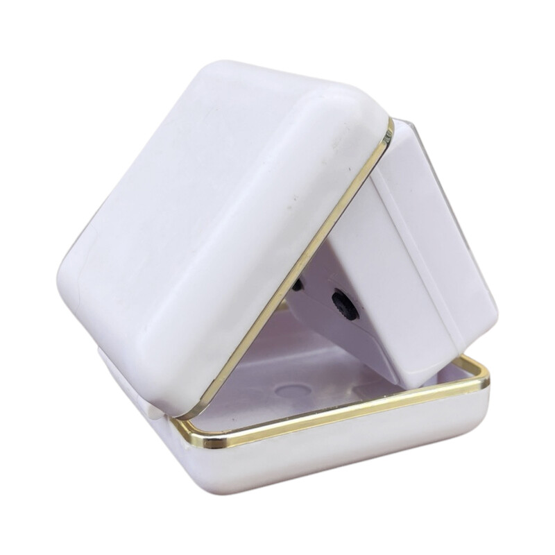 Vinage white travel alarm clock in plastic and brass, Germany 1990