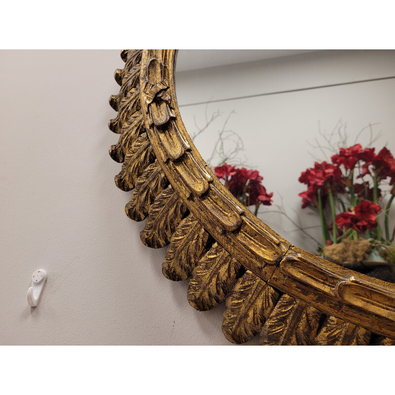 Vintage mirror in carved and gilded wooden frame