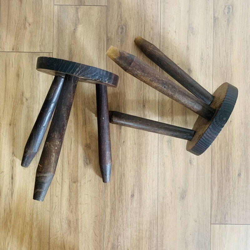 Pair of vintage tripod stools with round seats and pencil feet